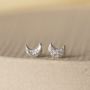 
                  
                    Sterling silver textured mini moon studs by Lucy Kemp Jewellery 
                  
                