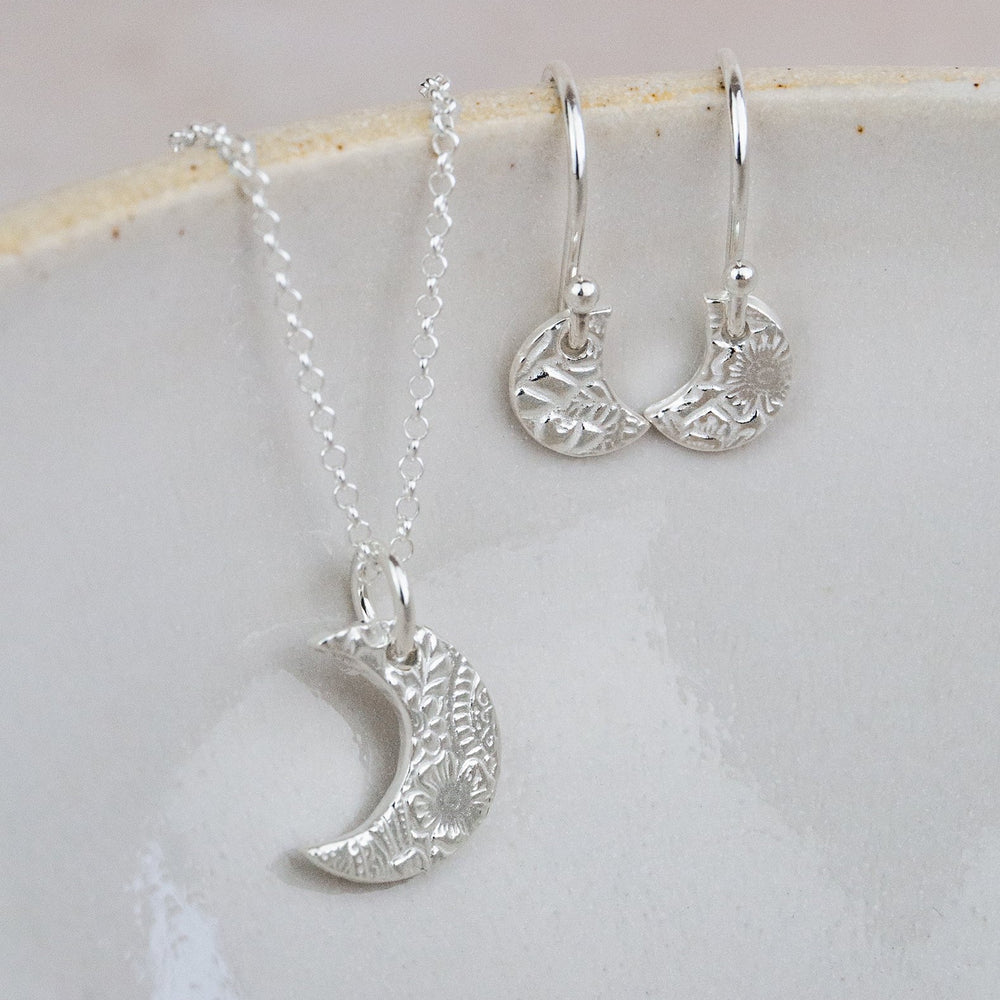 
                  
                    sterling silver small textured moon pendant and earrings by Lucy Kemp Jewellery
                  
                