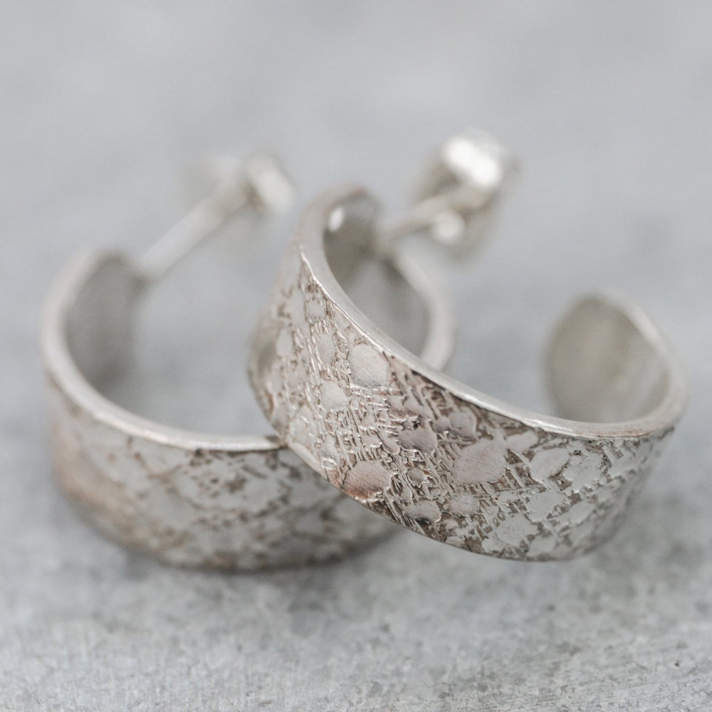 
                  
                    sterling silver marble textured hoops handmade by Lucy Kemp Jewellery
                  
                