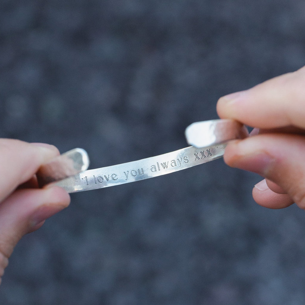 sterling silver personalised engraved cuff for men handmade by Lucy Kemp Jewellery - held image