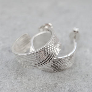 
                  
                    sterling silver wood grain textured thick hoops
                  
                