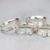 handmade sterling silver spinner rings with hammered texture and semi precious stones by Lucy Kemp Jewellery 