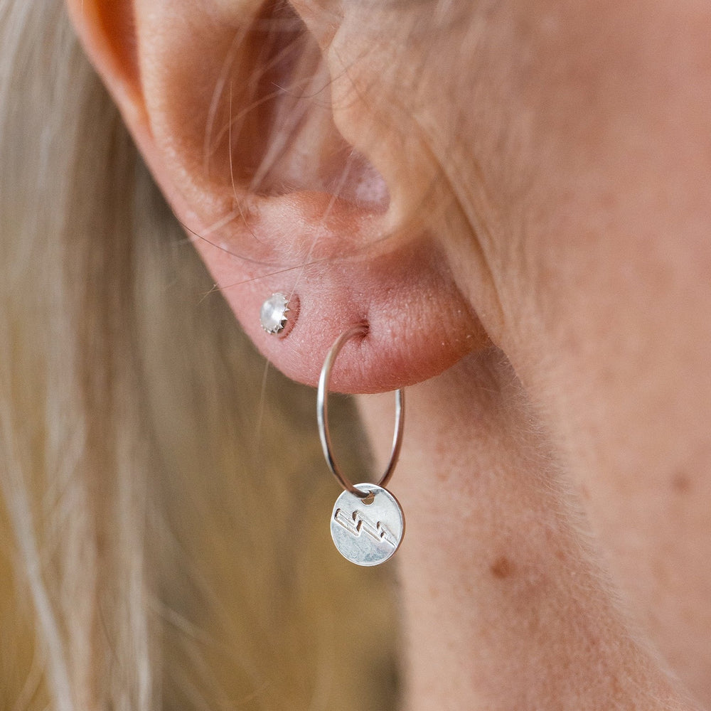 worn sterling silver stamped lightning bolts hoops handmade by Lucy Kemp Jewellery