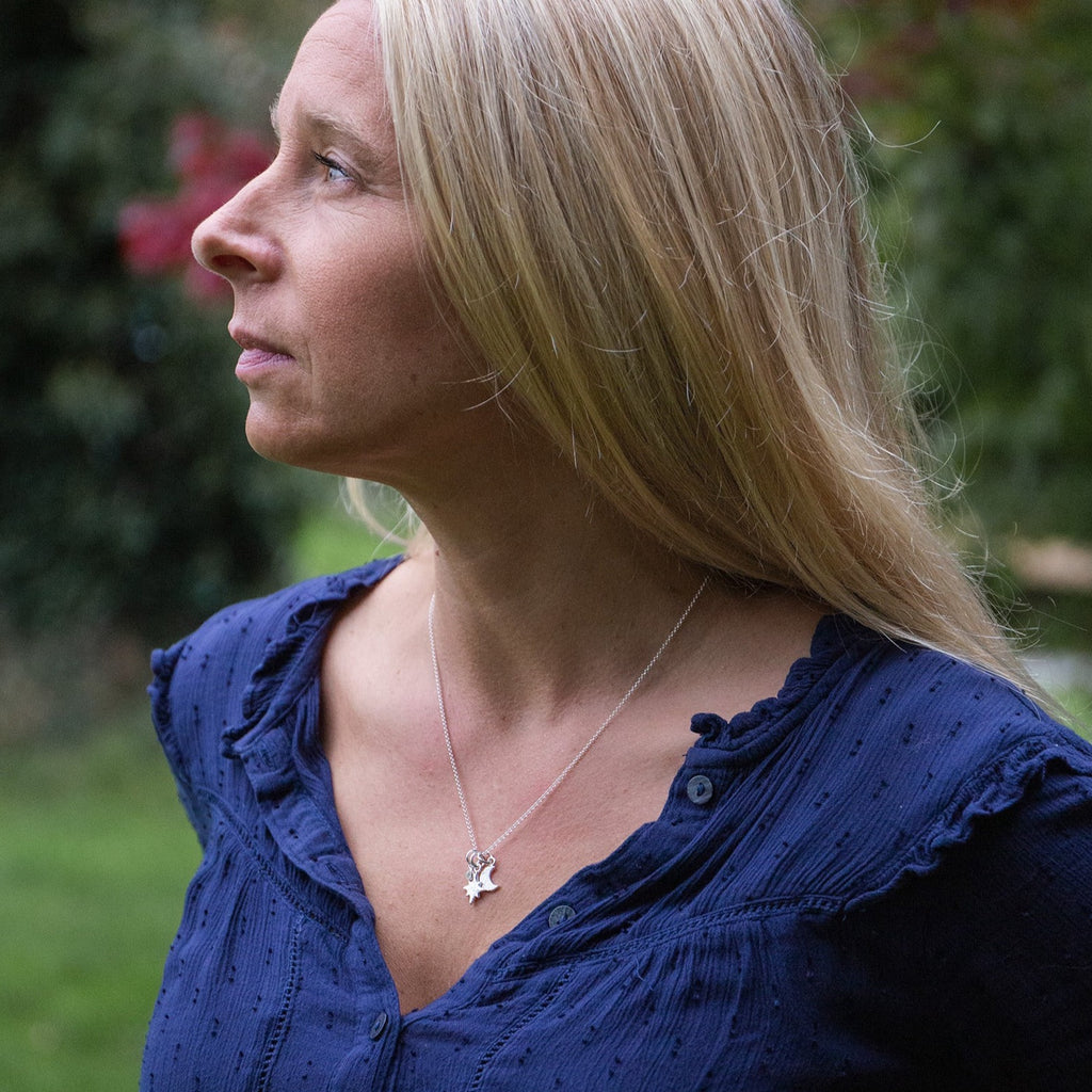 Handmade sterling silver star and moon birthstone cluster necklace by Lucy Kemp Jewellery - worn image