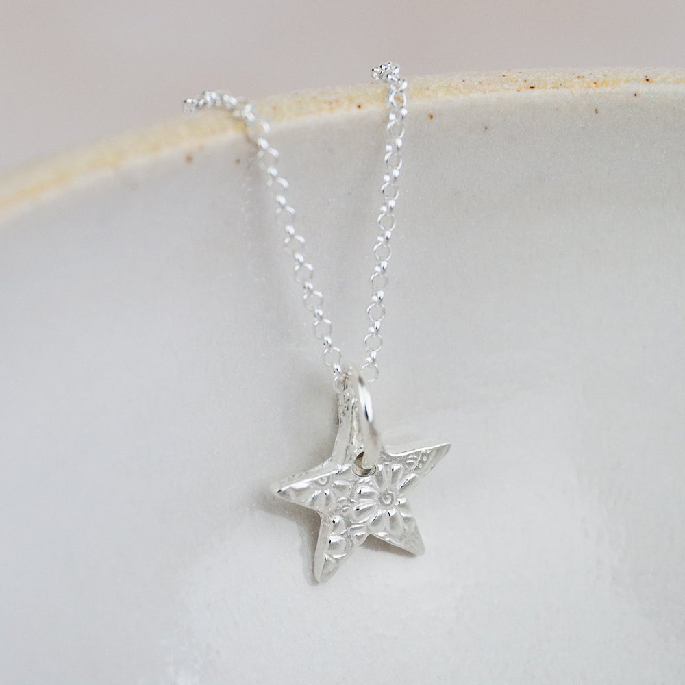 
                  
                    sterling silver small textured star pendant by Lucy Kemp Jewellery
                  
                