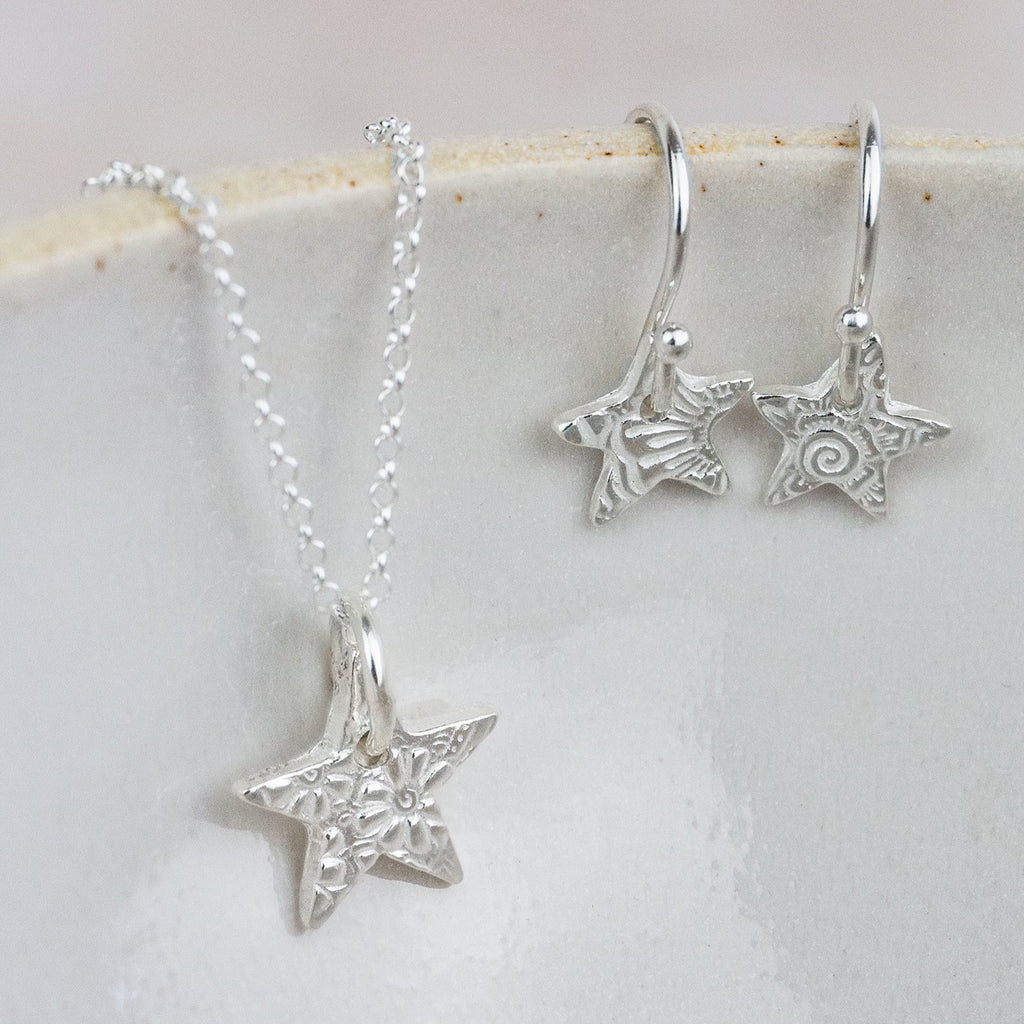 sterling silver small textured star pendant and earrings set by Lucy Kemp Jewellery