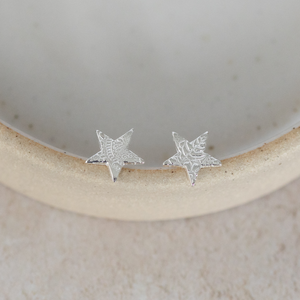 
                  
                    Sterling silver textured star studs by Lucy Kemp Jewellery
                  
                