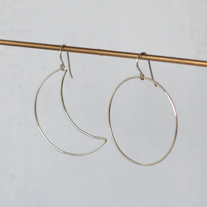 
                  
                    Handmade sterling silver mismatch sun and moon earrings by Lucy Kemp Jewellery
                  
                