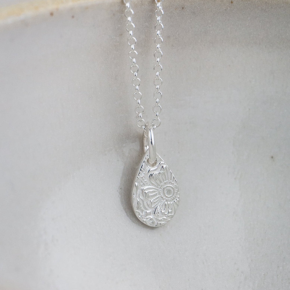 
                  
                    Sterling silver small textured teardrop pendant by Lucy Kemp Jewellery 
                  
                