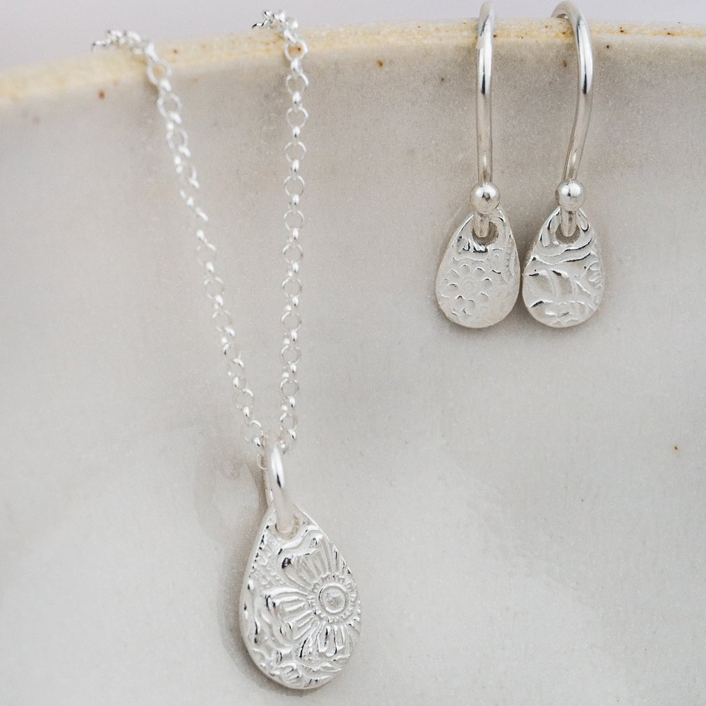 
                  
                    Sterling silver small textured teardrop pendant and earrings set by Lucy Kemp Jewellery
                  
                