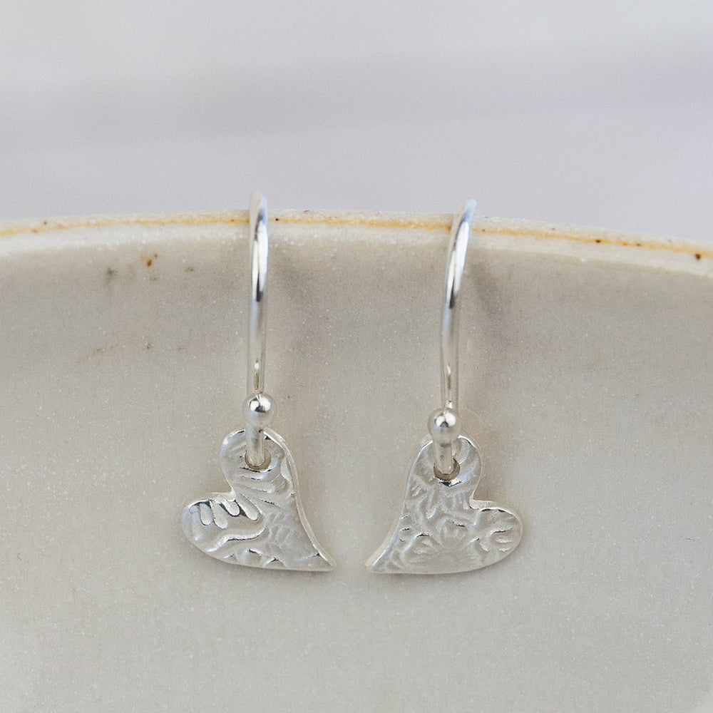 
                  
                    sterling silver mini tilted heart textured earrings
                  
                