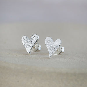 
                  
                    sterling silver textured tilted heart studs by Lucy Kemp Jewellery 
                  
                