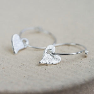 
                  
                    handmade sterling silver textured tilted heart charm classic wire hoops
                  
                