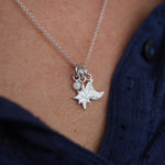 Handmade sterling silver star and moon birthstone cluster necklace by Lucy Kemp Jewellery - worn image